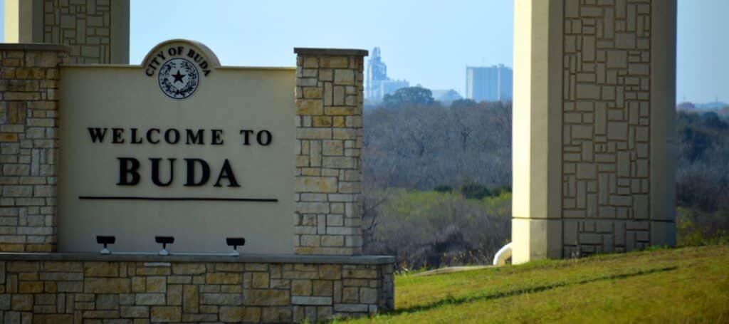 closeup of welcome to buda, city of buda sign on I-35