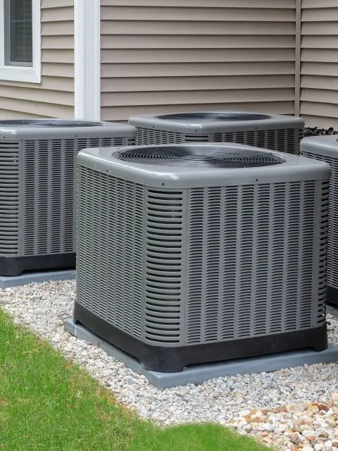 Group of outdoor heat pump units outside a home