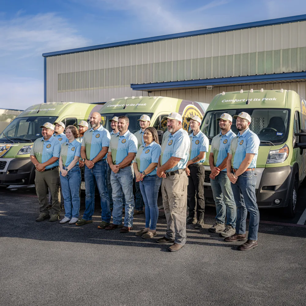 Summit Air Conditioning & Heating team in front of the company vans