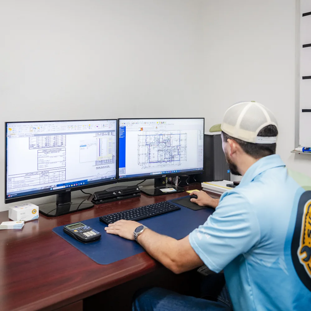 Summit AC team member working on a computer